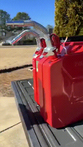 Flexible spout attached to a jerry can, shown bending